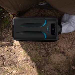 The iTechworld iFROST Portable Air Conditioner (1000W/3412BTU) sits beside a camper outdoors with its flexible exhaust hose and digital controls—ideal for cool comfort wherever you set up camp.
