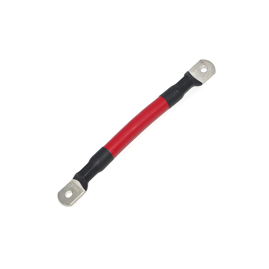 The iTechworld 000AWG Battery Parallel Cable is a short, thick cable with red and black insulation and metal ring terminals on both ends, designed for heavy-duty electrical circuit connections.