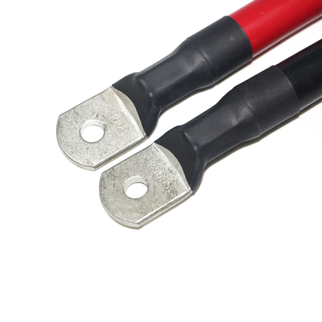 The iTechworld 000AWG Battery Parallel Cables include two heavy-duty cables—one red, one black—with metal ring terminals, bolting holes on each end, and black insulation near the terminals.