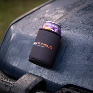 A 375mL can with a purple label sits inside an iTechworld Magnetic Stubby Holder on a wet, dark blue vehicle hood speckled with water droplets.