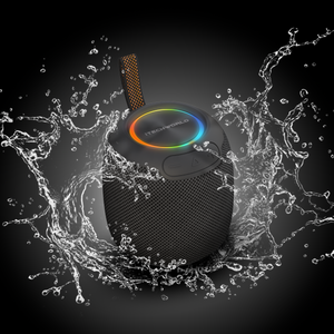 The iTechworld Pulse Mini, a waterproof portable speaker with vibrant LED lights and an orange strap, is showcased amid splashing water, emphasizing its water-resistant build and high-fidelity audio.