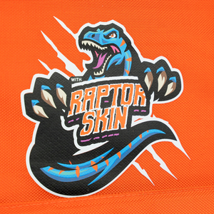 A vibrant blue raptor with sharp teeth and claws holds a WITH RAPTOR SKIN sign, standing out on an orange background—ideal for fans of portable solar tech like the 400W Solar Blanket with Raptor Skin.