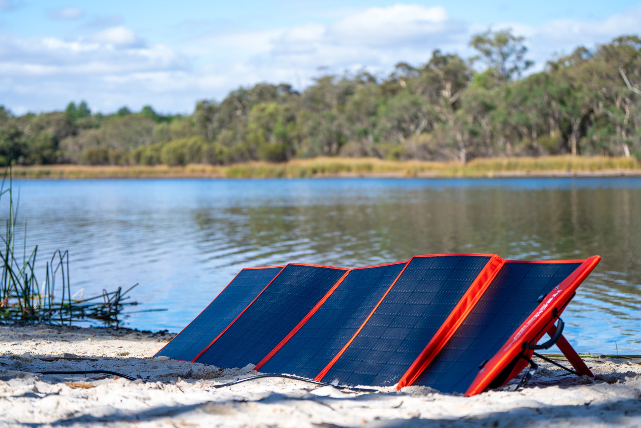 A solar blanket unfolded and charging 