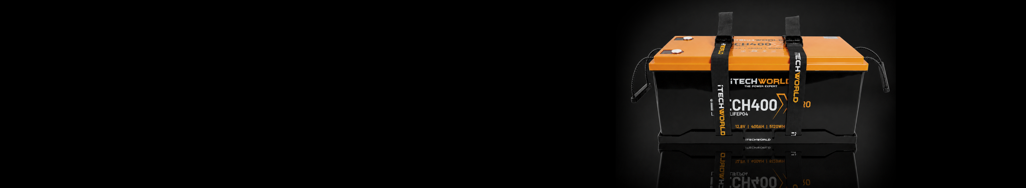 A rectangular TechnoCell CH400 battery with an orange top, black body, and black straps is shown against a plain light background.