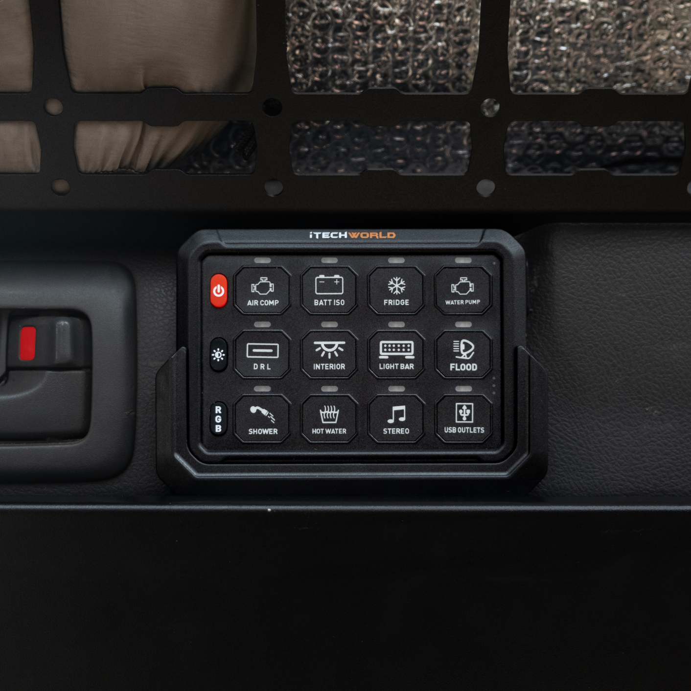 A close-up of the iTechworld 12 Gang Wireless Switch Panel, featuring labeled buttons for functions like air compressor, fridge, lights, and more—ideal for managing 4WD accessories and ensuring effortless system control.