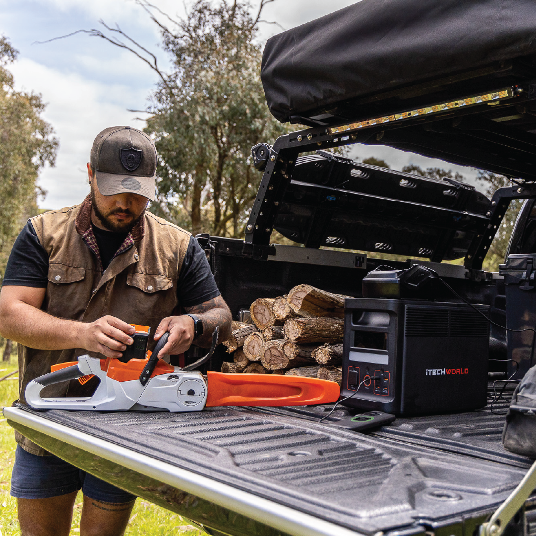 Camper charging his battery powered chainsaw with the 1800W PRO Portable Lithium Power Station