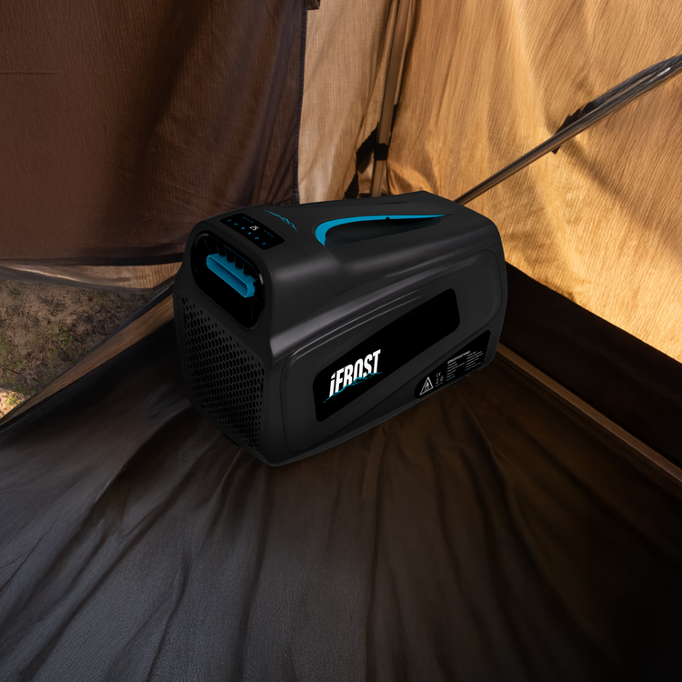 The iTechworld iFROST Portable Air Conditioner (1000W/3412BTU) rests on a tent floor as sunlight pours in—ideal for powering your camping air conditioner or keeping caravan cooling devices running on your outdoor trips.