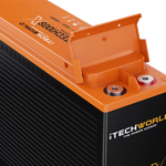 Close-up of an orange and black iTechworld iTECH100SX Slim Deep Cycle Lithium Battery with Bluetooth, 100Ah LifePO4, showing branding, exposed terminals, and a partially open lid.