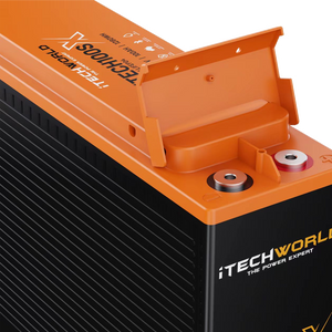 Close-up of an orange and black iTechworld iTECH100SX Slim Deep Cycle Lithium Battery with Bluetooth, 100Ah LifePO4, showing branding, exposed terminals, and a partially open lid.