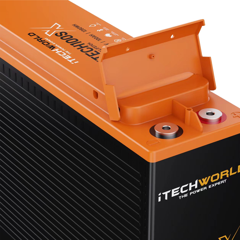 Close-up of an orange and black iTechworld iTECH100SX Slim Deep Cycle Lithium Battery with Bluetooth, 100Ah LifePO4, showing branding, exposed terminals, and a partially open lid.