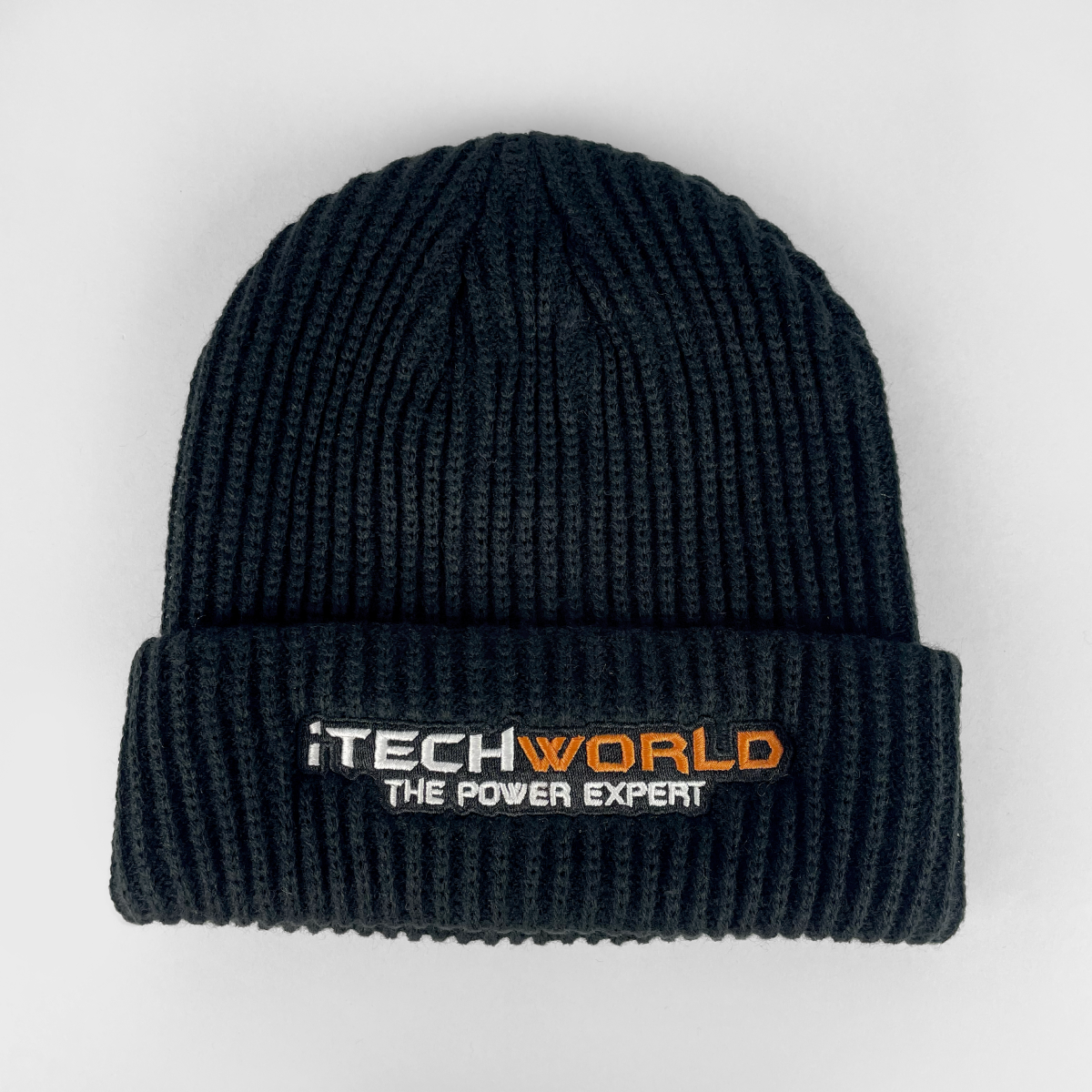 Stay warm with the iTechworld Black Beanie, featuring "THE POWER EXPERT" embroidered in white and orange. This insulating beanie by iTechworld is a cold-weather essential, shown on a plain white background.