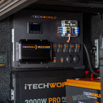 Close-up of the iTechworld 200Ah Control Hub Kit, featuring 2 x iTECH100Ah lithium batteries, a 40A DC-DC charger, power inverter, switches, fuses, and wiring installed inside a vehicle or equipment compartment.