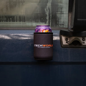 A 375mL can sits in an iTechworld Magnetic Stubby Holder, attached to the outside of a blue vehicle’s door near the handle, with condensation visible on the window.