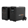 Two black iTechworld PS3600 portable lithium power stations, shown with wheels and handles—one reveals control panels and ports, the other shows the logo. Both feature a sleek design, ideal for home backup or on-the-go use. Includes EB3840 Expansion Battery Kit.