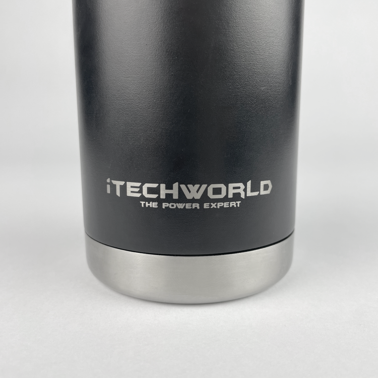 A close-up of a black iTechworld 375mL Can Cooler made of insulated stainless steel with a metal base. "iTECHWORLD THE POWER EXPERT" is printed in white on the cooler.