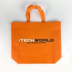 The iTechworld Tote Bag is a bright orange, reusable bag featuring "THE POWER EXPERT" text in black and white, two handles, and a flat bottom. Durable and stylish, this gear bag is shown on a white background.