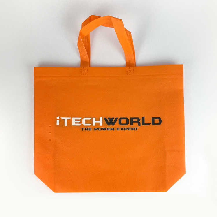 The iTechworld Tote Bag is a bright orange, reusable bag featuring "THE POWER EXPERT" text in black and white, two handles, and a flat bottom. Durable and stylish, this gear bag is shown on a white background.