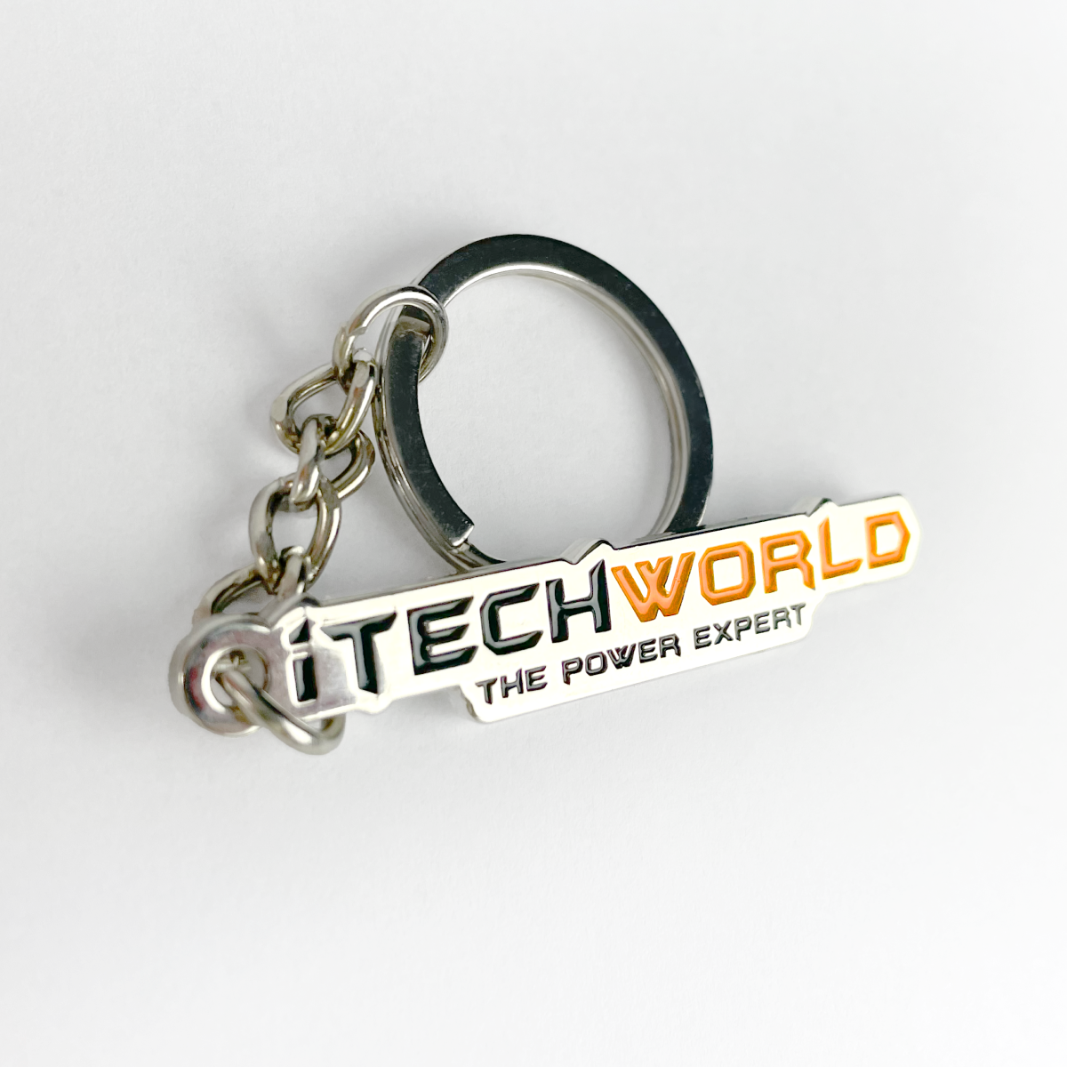 The iTechworld Keyring features a CNC-cut iron tag with "ITECHWORLD THE POWER EXPERT" in black and orange on white, plus a silver key ring and chain.